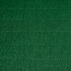 A close-up image of a green crepe paper with texture visible.